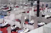  ?? MANU FERNANDEZ AP ?? A temporary field hospital is set up at Ifema convention and exhibition in Madrid, Thursday to help coronaviru­s patients.