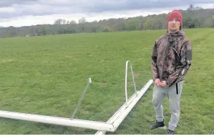  ??  ?? Jordan Love of Llandegfan FC with the broken goals