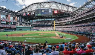  ?? Jeffrey Mcwhorter / Associated Press ?? Gov. Greg Abbott turned down an invitation to throw out the first pitch at the Texas Rangers’ home opener at Globe Life Field in Arlington on Monday.