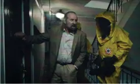  ??  ?? Going viral … Peter Stormare pays an infected resident a visit in Songbird. Photograph: STXfilms