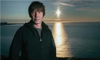  ?? ?? Prof Brian Cox on the cliffs of southern Iceland as the sun rises. Photograph: Freddie Claire/BBC