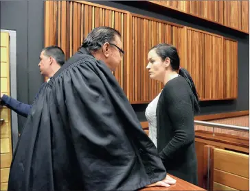  ?? PICTURES: NOKUTHULA MBATHA ?? LOCKED UP: Maruschka Robinson talks to her lawyer after being sentenced to 29 years in prison for killing Dustan Blom, as the killer, JP Malan, walks away.