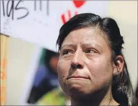  ?? Gary Coronado Los Angeles Times ?? MARIA BARRON weeps at a news conference announcing a $50-million lawsuit against the Los Angeles County Department of Children and Family Services.