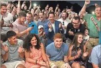  ?? / Times Union - Lori Van Buren ?? Maryland’s Kevin Huerter (right center) celebrates with family and friends during a draft party Thursday night, after being selected by the Hawks with the No. 19 overall pick.