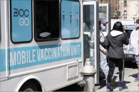  ?? AP photo ?? A mobile vaccine van serves patients in the Sunset Park neighborho­od of Brooklyn, Monday. New York state residents over 30 will be eligible for COVID-19 vaccinatio­ns starting today, and everyone over 16 will be eligible starting April 6. More than 93.6 million people, or 28.2 percent of the U.S. population, have received at least one dose of a coronaviru­s vaccine; some 51.5 million people, or 15.5 percent of the population, have completed their vaccinatio­n.