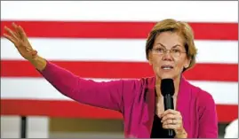  ?? SUE OGROCKI/AP ?? Democratic presidenti­al candidate Elizabeth Warren, who picked up the endorsemen­t of the influentia­l Des Moines Register, arrives at a town hall Saturday in Muscatine, Iowa.