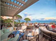  ?? TNS ?? The deck of the Ocean Club at Sea Pines Plantation is the perfect place to catch a sunset.