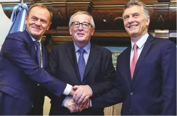  ?? AFP ?? Argentina’s President Mauricio Macri (right) welcomes the President of the European Commission Jean-Claude Juncker and President of the European Council Donald Tusk, in Buenos Aires yesterday.