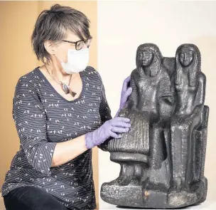  ??  ?? WELL TRAVELLED: This 3,000-year-old granite sculpture of high priest Sethmose and his wife, Isisnofret, was originally a gift to Thomas Cook’s son
