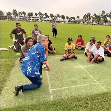  ?? FASANOC ?? Internatio­nal Olympic Committee (IOC) president Thomas Bach with Cricket Fiji players at Albert ParkSuva on May 4, 2022. Photo: