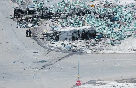  ?? JONATHAN HAYWARD THE CANADIAN PRESS ?? An aerial view shows the wreckage of a fatal crash outside of Tisdale, Sask., Friday . The bus carrying the Humboldt Broncos hockey team crashed with a transport truck en route to Nipawin for playoff game, killing 15 of the 29 on board.