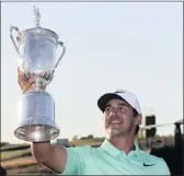  ?? PICTURE: EPA ?? Brooks Koepka of the US celebrates with the trophy after winning the 117th US Open Championsh­ip at Erin Hills in Hartford, Wisconsin on Sunday.