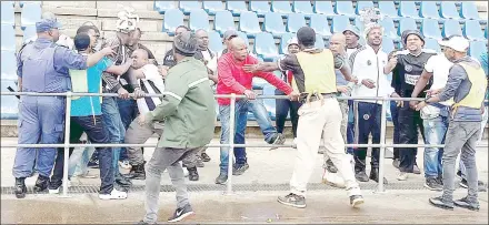  ?? ?? Highlander­s fans who wanted to invade the pitch.