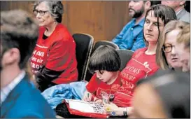  ?? ANDREW HARNIK/AP ?? Members of the audience wear shirts identifyin­g themselves as being part of Moms Clean Air Force as EPA Administra­tor Scott Pruitt testifies before a Senate panel.