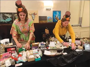  ?? Herald photo by Dale Woodard ?? Ragean Jones of Feeling Inspired Health and Healing of Lethbridge, left, and Bridget Rediker of Goddess Glow Spa in Picture Butte tend to their table at the Gypsy Soul Psychic and Vendor Market Saturday at the Sandman Inn.