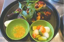  ?? MIA STAINSBY ?? Chili-roasted Cornish game hen is served with pickled veg.