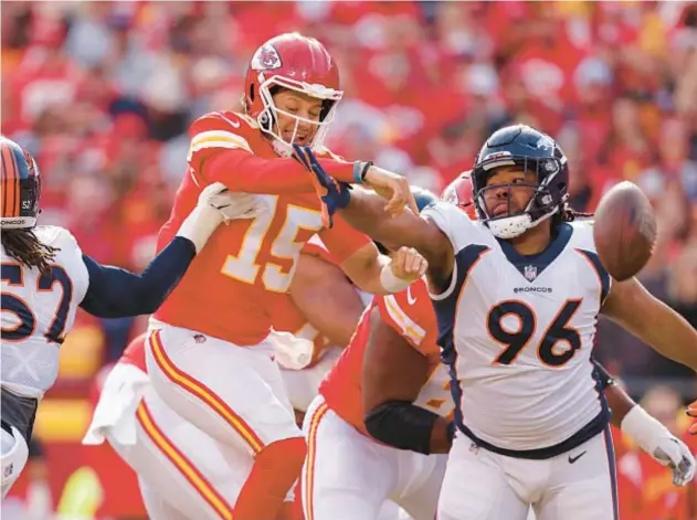  ?? GETTY ?? Eyioma Uwazurike (96) knocks ball away from Chiefs’ Patrick Mahomes in January game in Kansas City. Uwazurike was suspended by NFL on Monday.