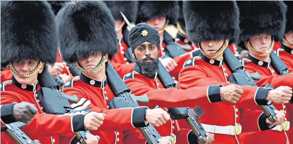  ??  ?? Gdmn Charanpree­t Singh Lall will become the first Coldstream Guards soldier to wear a turban instead of a bearskin when he joins his colleagues at Horse Guards Parade for Trooping the Colour today