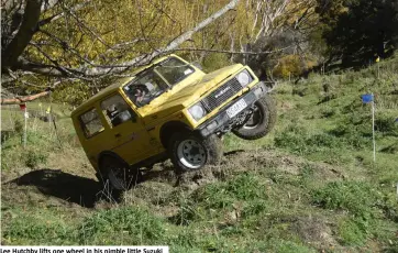  ??  ?? Lee Hutchby lifts one wheel in his nimble little Suzuki