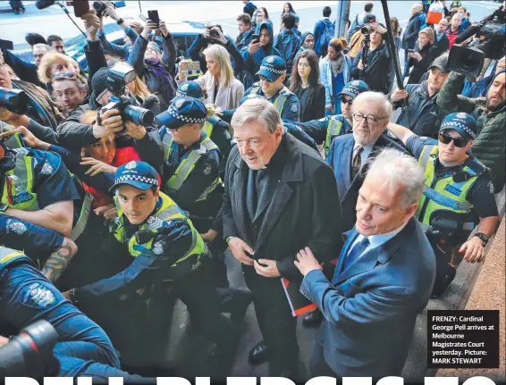  ?? FRENZY: Cardinal George Pell arrives at Melbourne Magistrate­s Court yesterday. Picture: MARK STEWART ??