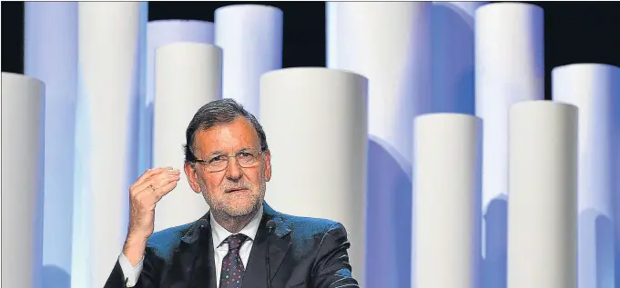  ?? GERARD JULIEN / AFP PHOTO ?? El presidente Mariano Rajoy no está rentabiliz­ando electoralm­ente el éxito de volver a crecer y a crear empleo