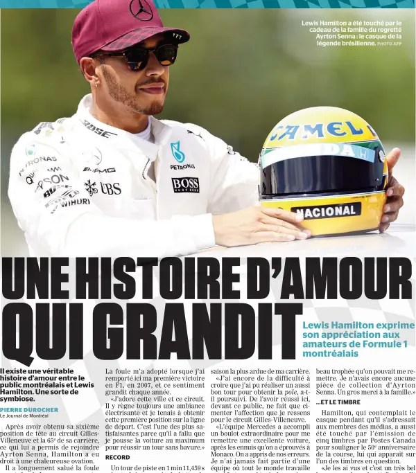  ??  ?? Lewis Hamilton a été touché par le cadeau de la famille du regretté Ayrton Senna : le casque de la légende brésilienn­e.