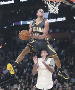  ?? Ronald Martinez Getty Images ?? GLENN ROBINSON III of Indiana really rose to the occasion during the slam-dunk contest. He won after a perfect score on his final dunk.