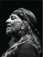  ?? Democrat-Gazette/Art Meripol) ?? This Art Meripol portrait of Willie Nelson captured the crooner wearing a rapt expression. (Special to the