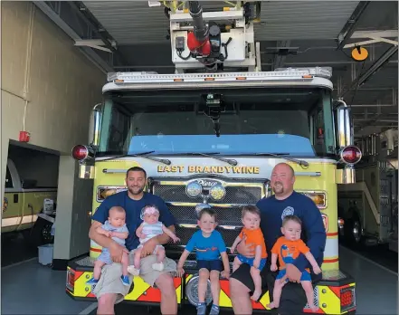  ?? SUBMITTED PHOTO ?? Vincent D’Amico and Eddie Rank, members of the East Brandywine Fire Company, with their children at the fire house.