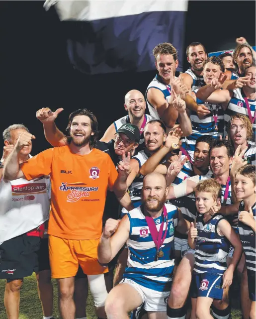  ??  ?? PURE PERFECTION: Premiers Port Douglas Crocs celebrate their win against the Manunda Hawks in the AFL Cairns Men’s grand final at