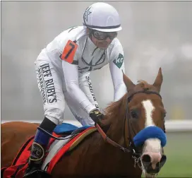  ?? PATRICK SMITH / GETTY IMAGES ?? On Saturday at the Belmont Stakes, Justify, with jockey Mike Smith, is looking to become the 13th horse to win the Triple Crown.