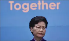  ?? Photograph: Vincent Yu/AP ?? Carrie Lam listens to reporters' questions after pro-Beijing parties swept the Hong Kong election