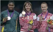  ??  ?? NOT VERY HAPPY: Russia’s Mariya Savinova, centre, wins gold, South Africa’s Caster Semenya won silver and Russia’s Ekaterina Poistogova won bronze in London.