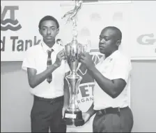  ?? ?? Captain of Christianb­urg/Wismar Secondary Devon Gilbert (left), and Golden Grove skipper Kellon Croal posing with the championsh­ip trophy