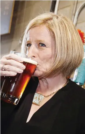  ??  ?? TODD KOROL/THE CANADIAN PRESS Alberta Premier Rachel Notley drinks a beer while touring the Cold Garden Beverage Company in Calgary in 2017. The Alberta government has taken the first step in a trade challenge against Ontario over liquor policies.