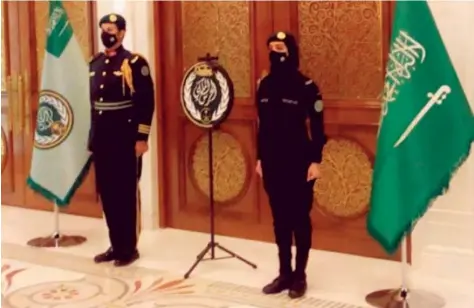  ??  ?? Saudi social media users expressed their pride and joy on Friday when a photo appeared of a female member of the Saudi Royal Guard performing her duty alongside her male colleague at a high-profile government office. The government last year announced vacancies for Saudi women for the jobs of corporal, sergeant and private. Applicants were shortliste­d after tests and interviews.