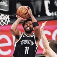  ?? Adam Hunger / Associated Press ?? Kyrie Irving, missing since he refused to comply with New York City’s vaccinatio­n mandates during the preseason, was recently welcomed back from that self-imposed exile by the Brooklyn Nets.
