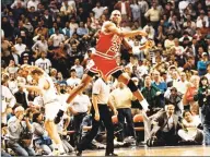  ?? Ed Wagner / McClatchy-Tribune News Service ?? The Chicago Bulls’ Michael Jordan reacts after hitting the winning basket over Cleveland’s Craig Ehlo, left rear, in Game 5 of the NBA playoffs May 7, 1989, in Cleveland.