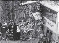  ??  ?? Emergency and rescue crews respond to the scene of a tour bus crash on the Pennsylvan­ia Turnpike on Saturday, near Carlisle, Pa. The Seton Hall women’s lacrosse team and three coaches were among 23 on board.