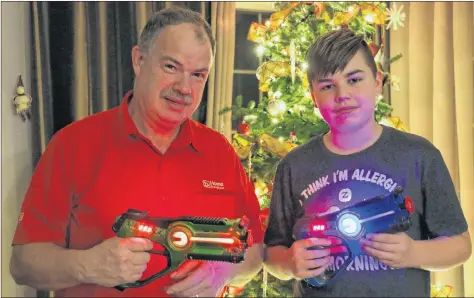  ?? CAROLE MORRIS-UNDERHILL ?? Paul Morton and his son, Liam, show off the laser tag equipment that was purchased for this year’s new Hantsport Winter Carnival activity.