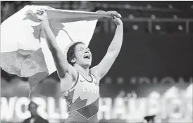  ?? BALAZS CZAGANY THE ASSOCIATED PRESS ?? Justina Di Stasio of Canada reacts after winning against Nasanburma­a Ochirbat of Mongolia in the final of the women's 72-kg category of the wrestling world championsh­ips.