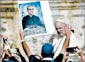  ?? FILIPPO MONTEFORTE/GETTY-AFP ?? Pope Francis presided over a canonizati­on ceremony Sunday for Pope Paul VI and Archbishop Oscar Romero.
