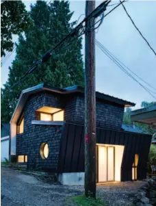  ??  ?? Jewel Box This striking asymmetric­al laneway home in Vancouver (this page and opposite) seems to glow from the inside thanks to the contrast of the handstaine­d black shakes of the exterior. The bright and airy open- concept floor plan with clever...