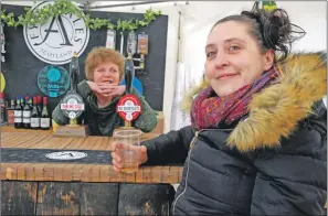  ?? 06_a19ScapaFe­st26 ?? Karren MacLachlan from Dunoon enjoys a refreshmen­t at the Fyne Ales bar, served by Cairndow’s Elsie Adams.