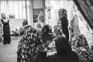  ??  ?? Afghan women take part in a life-skills class at a women’s shelter in Kabul. Managed by the charity Women for Afghan Women (WAW), the shelter has given a new lease of life to women in a country where rape, abuse and forced marriages are commonplac­e. —...