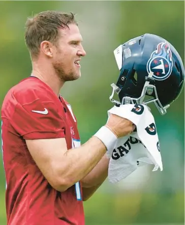  ?? MARK HUMPHREY/AP ?? Titans QB Ryan Tannehill takes part in drills during training camp at the team’s practice facility on Thursday in Nashville, Tenn. Tannehill goes into his fourth season needing to prove 2021 was simply an off year and that he can win when it matters most.