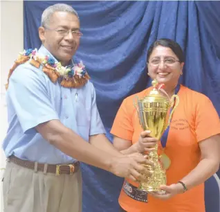  ??  ?? Labasa Hospital medical superinten­dent doctor Jaoji Vulibeci present the Best Leadership Trophy and gold medal to Sister Salma Hussein during the Nurses Awards Day celebratio­n yesterday.