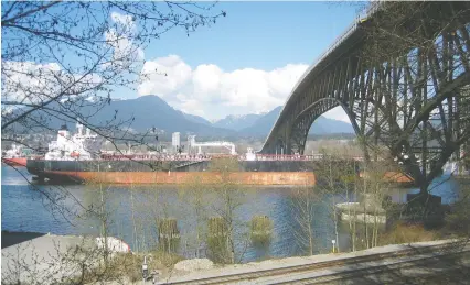  ??  ?? The oil tanker Erik Spirit moves under the Second Narrows Bridge in Vancouver on March 30. Canada is already shipping oil overseas.