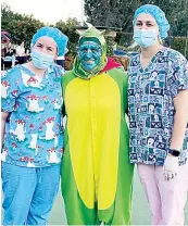  ?? ?? Adding to the atmosphere of the night, “most outlandish attire” also was won by Baw Baw Paws. Georgie Patterson (left) and Tira Warn posed with bowls club member Ciska Axford.