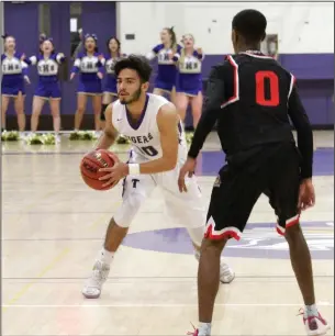  ?? MIKE BUSH/NEWS-SENTINEL ?? Tokay guard Victor Nateras (10) looks for a teammate to pass the ball while Lincoln guard Darius Harris watches in Friday's TCAL boys basketball game at The Jungle.